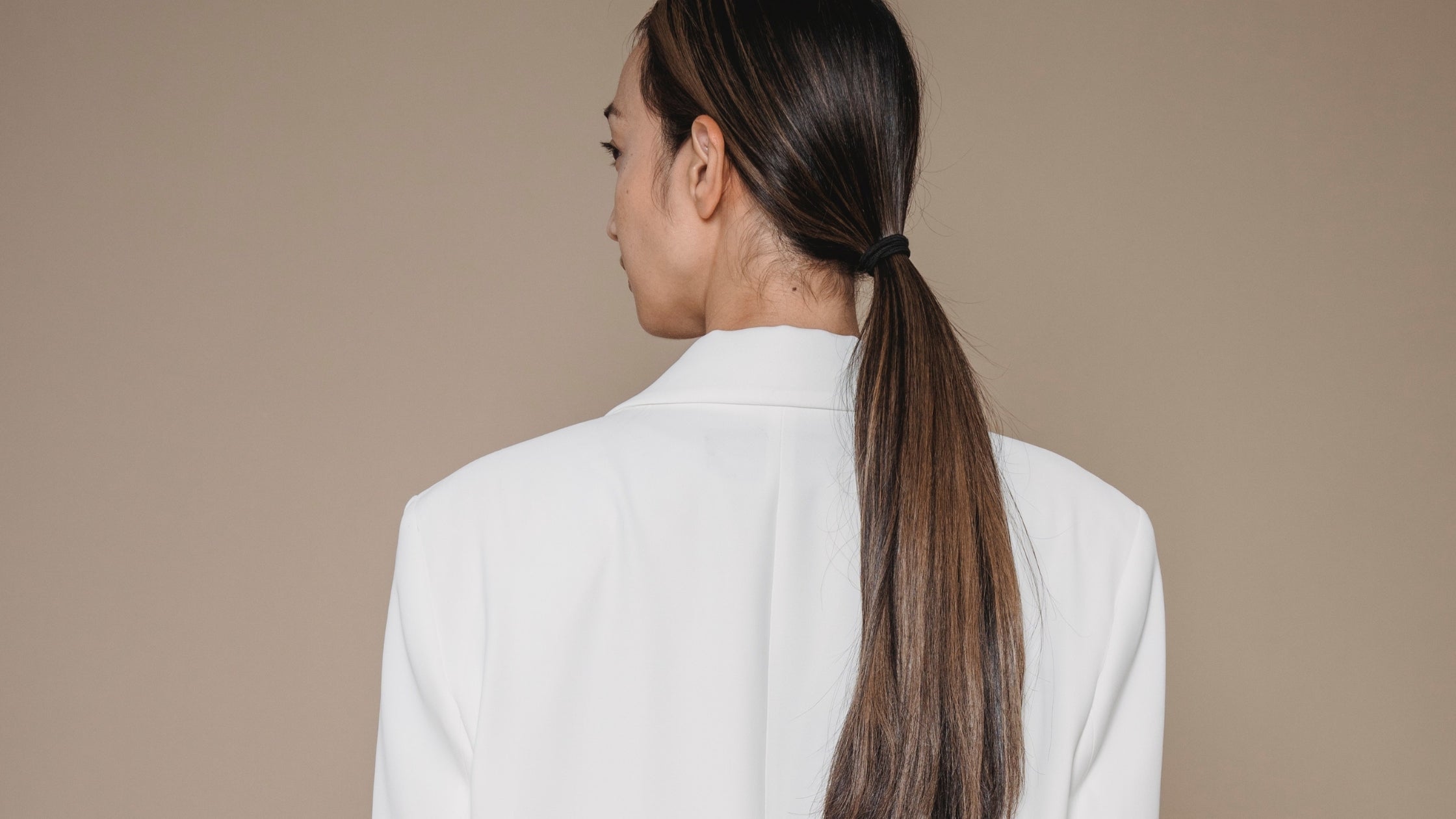 Blog banner for Frontrow blog topic: how to create sleek low ponytail with Frontrow clip-in ponytail extensions
