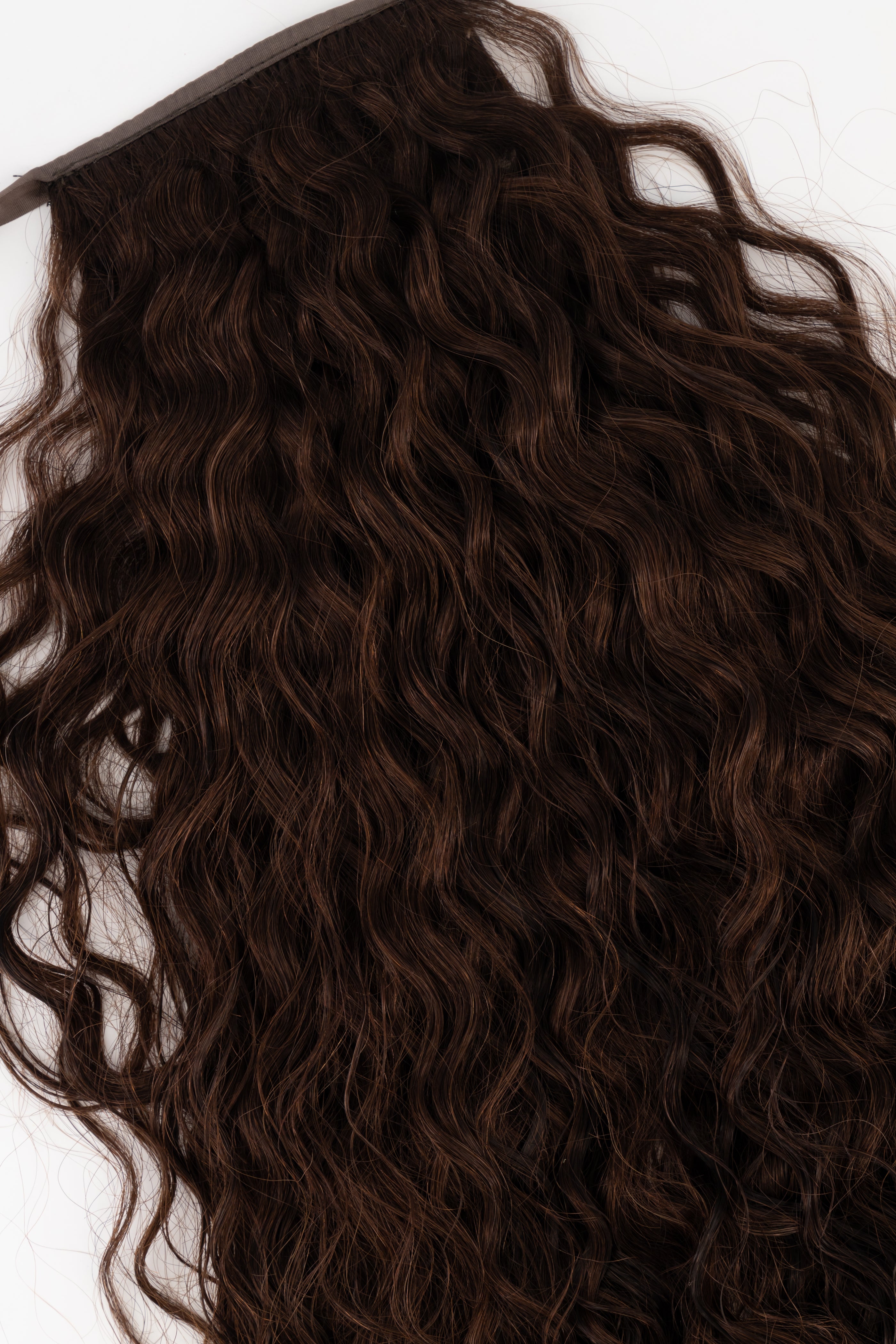 Frontrow curly clip-in ponytail extensions in dark brown