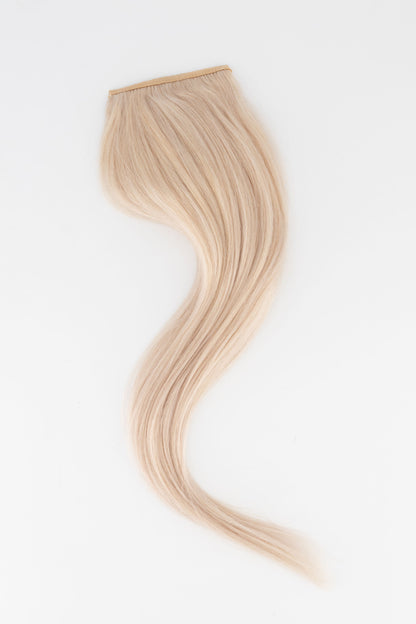 Frontrow clip-in ponytail extensions in ash blonde