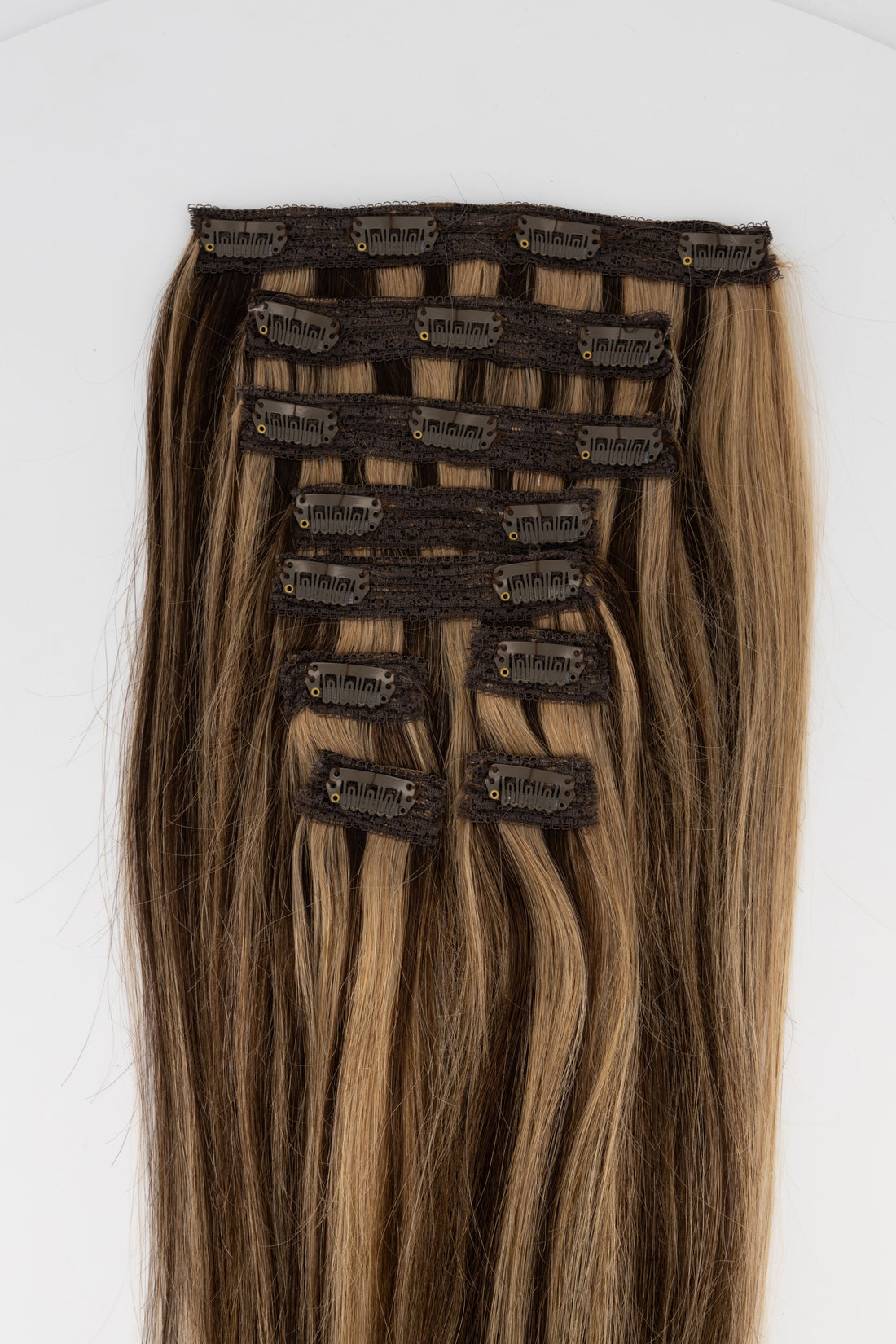 Frontrow clip-in hair extensions in highlighted brown