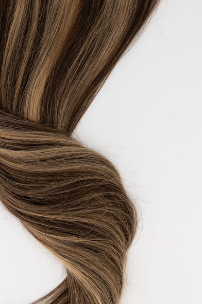 Frontrow clip-in hair extensions in highlighted brown